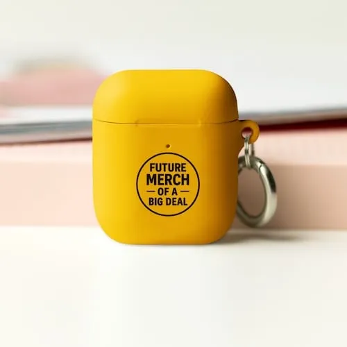 A yellow Airpods case with black text that says Future Merch of a Big Deal representing tech accessory promotional products available in our store for same-day online ordering in Atlanta .